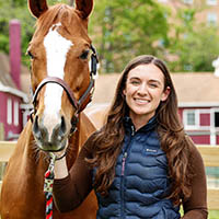 Rose with horse in front of barn