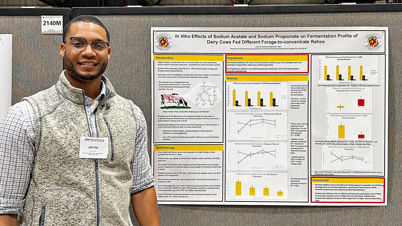 Jarvis Scott next to research poster